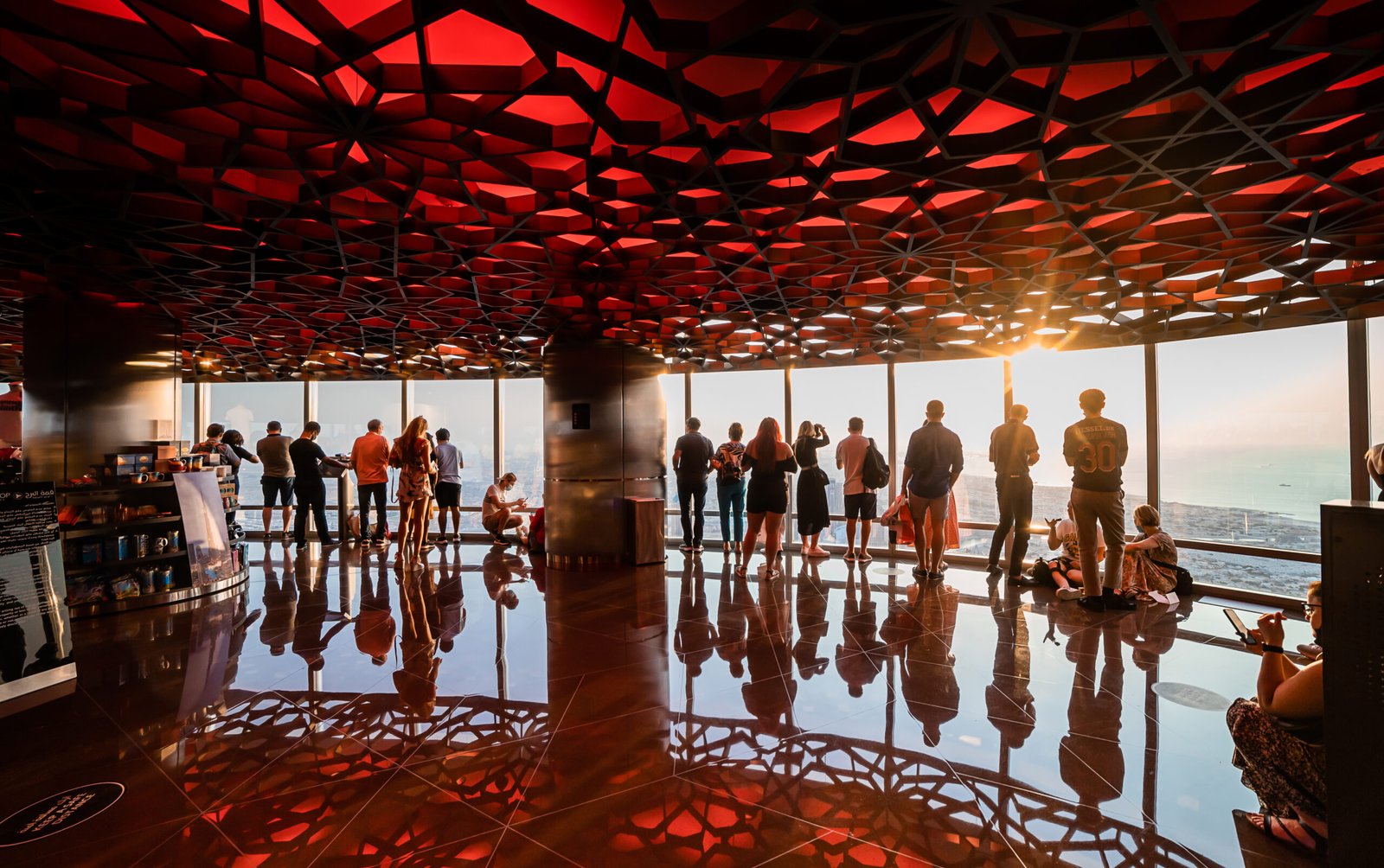Dubai, UAE - November 08, 2021: Groups of tourists at the At the top of Burj Khalifa , Dubai