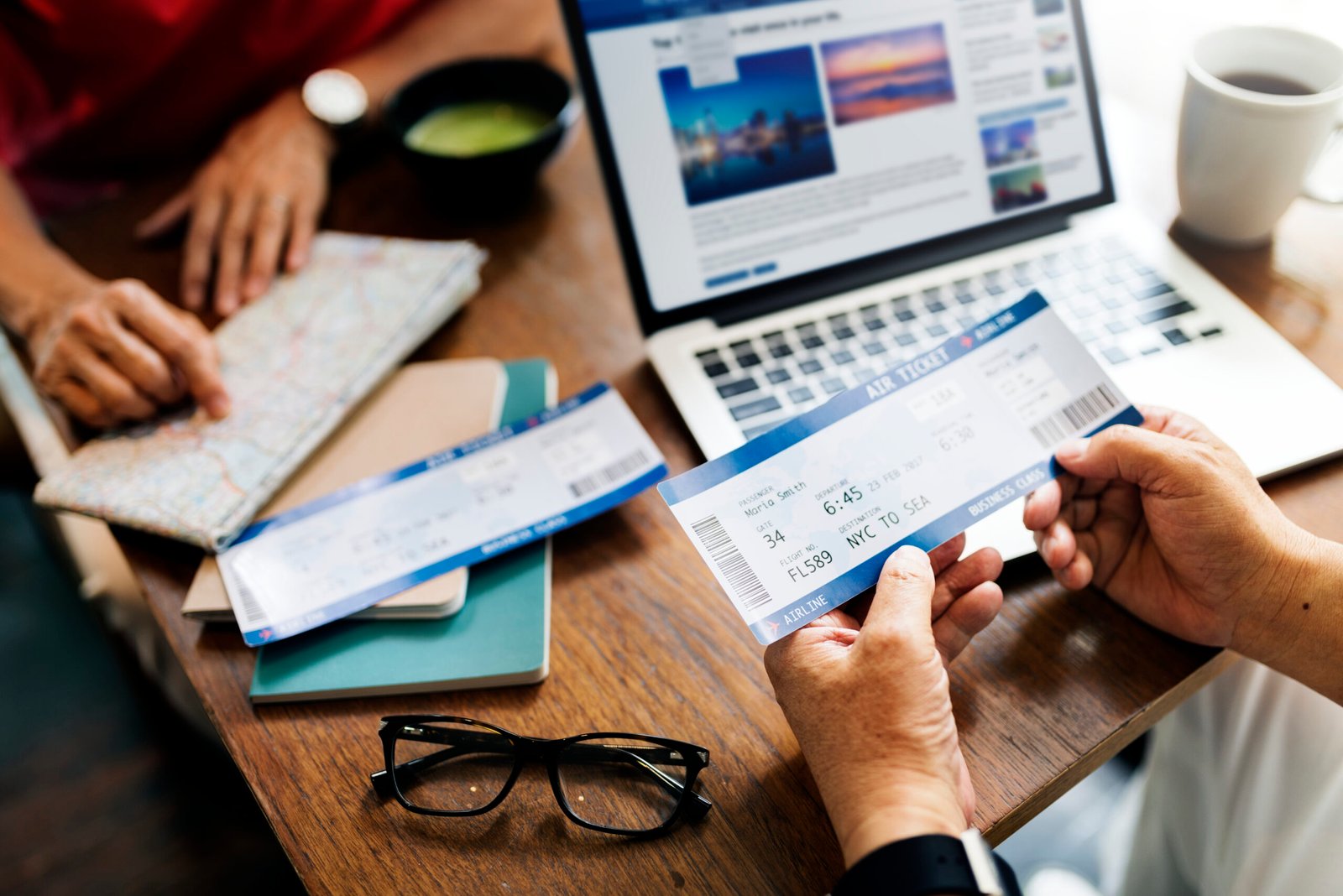 Senior Asian couple holding plane tickets